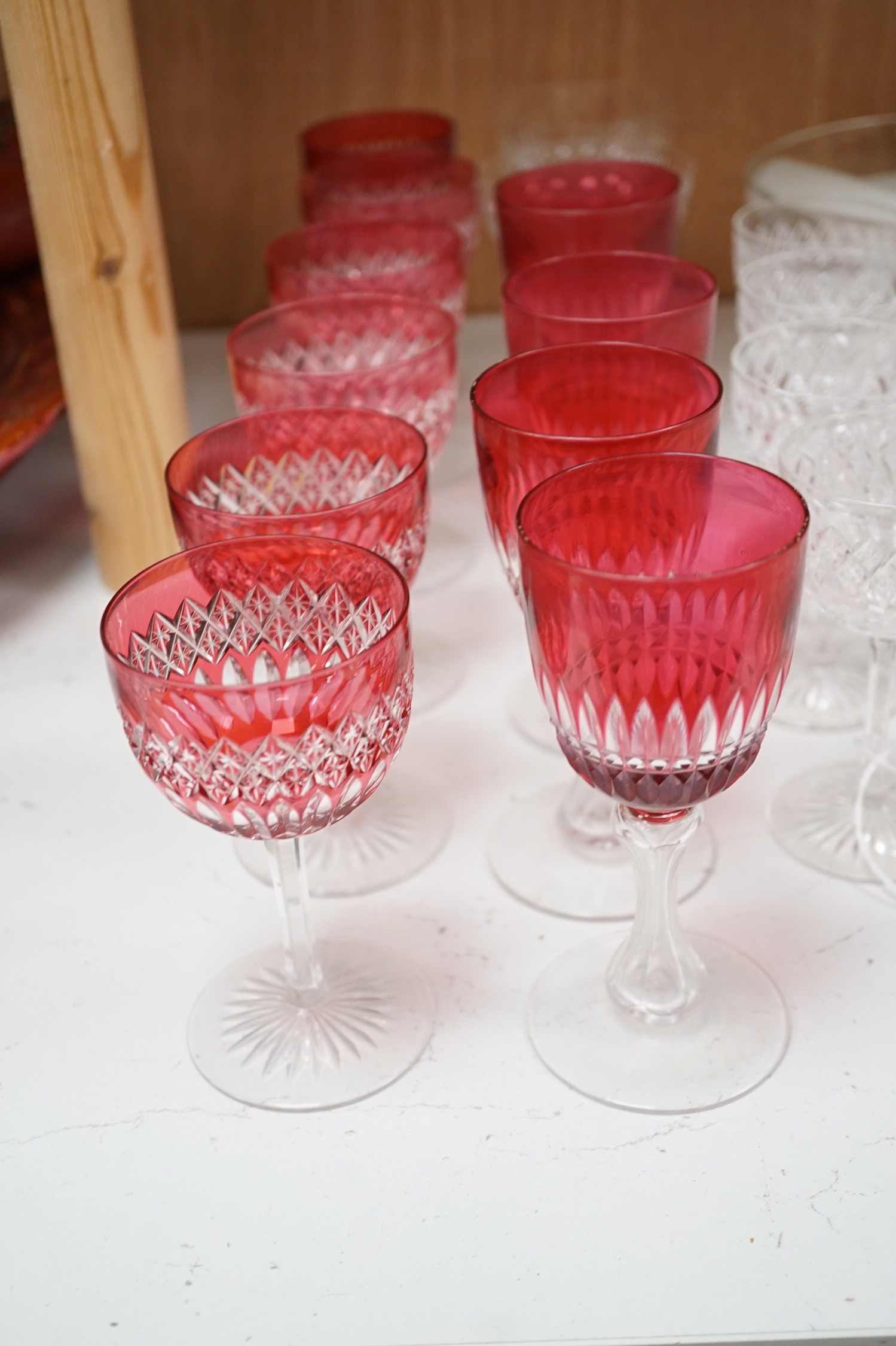 A set of cranberry flashed cut glass wine glasses, four others and collection of mixed cut glass